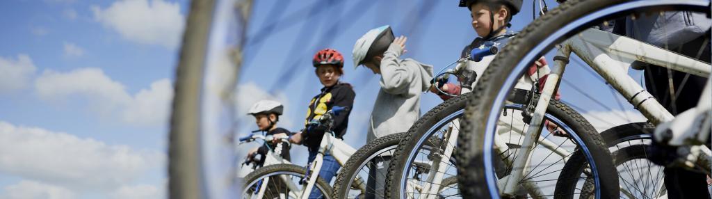 group of young people with mountain bikes