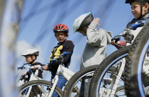 group of young people with mountain bikes