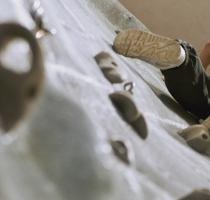 young person on a climbing wall