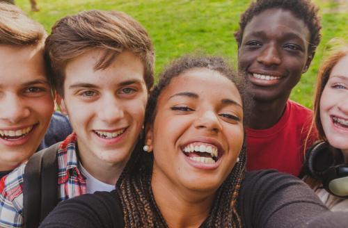 outdoor selfie of smiling young people