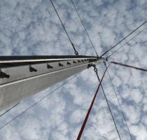metal pole of giant swing with blue sky and clouds