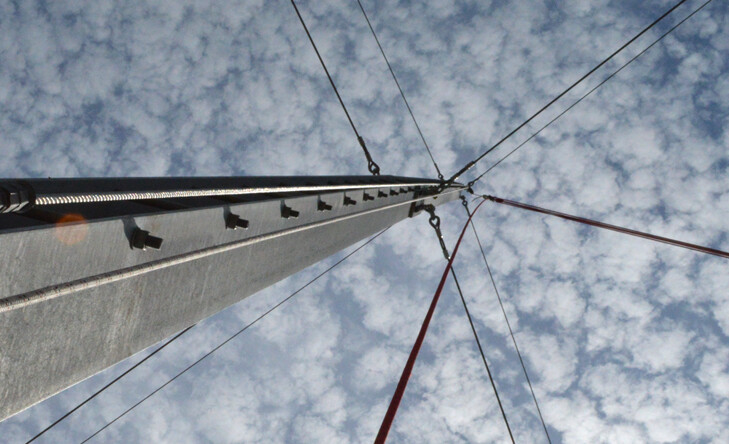 metal pole of giant swing with blue sky and clouds