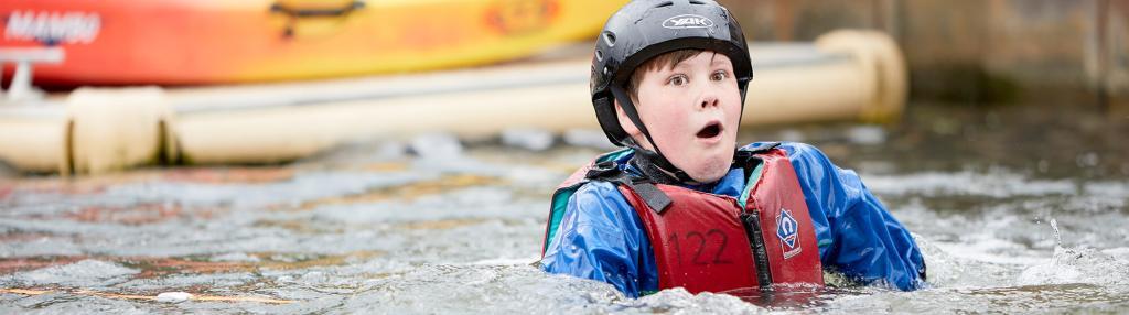 surprised boy in water