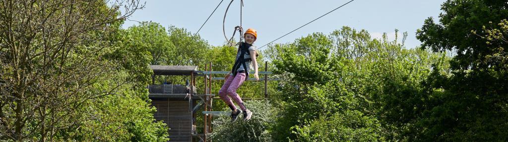 smiling girl on zipwire