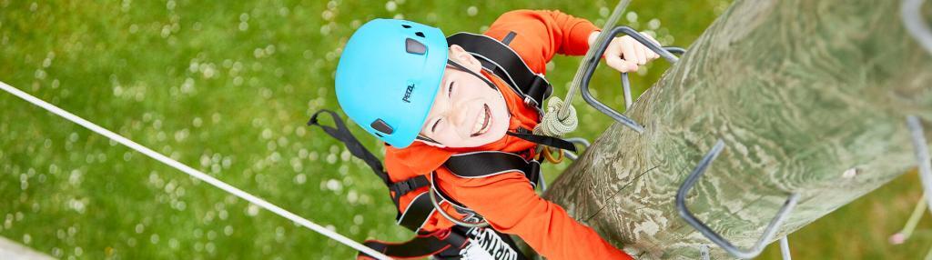 boy on high ropes course