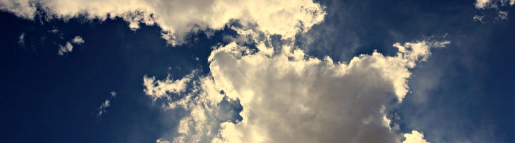 blue skies with fluffy white clouds