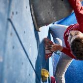 boy climber in red shirt