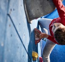 boy climber in red shirt