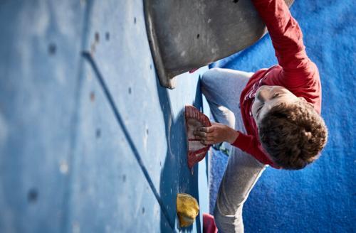 boy climber in red shirt