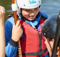 group of children and sup instructor