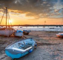 sunset and old boats at west mersea