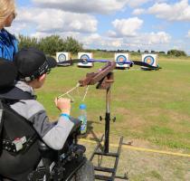 Young person trying archery