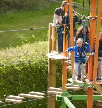 Family group on high ropes course