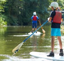 stand up paddle boarder on the river